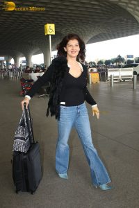 actress Sangeeta Bijlani gorgeous in a black top and blue jeans at mumbai airport