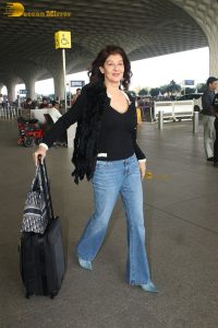 actress Sangeeta Bijlani gorgeous in a black top and blue jeans at mumbai airport