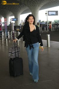actress Sangeeta Bijlani gorgeous in a black top and blue jeans at mumbai airport