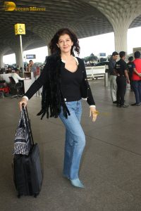 actress Sangeeta Bijlani gorgeous in a black top and blue jeans at mumbai airport