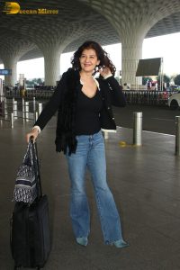actress Sangeeta Bijlani gorgeous in a black top and blue jeans at mumbai airport