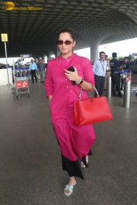 Indian tennis player Sania Mirza in a pink salwar dress at mumbai airport