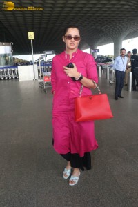 Indian tennis player Sania Mirza in a pink salwar dress at mumbai airport