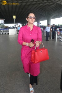 Indian tennis player Sania Mirza in a pink salwar dress at mumbai airport
