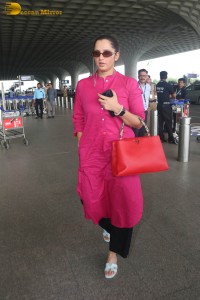 Indian tennis player Sania Mirza in a pink salwar dress at mumbai airport