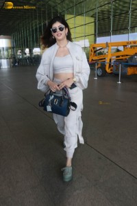 indian actress and model sanjana sanghi in a white dress at Mumbai airport