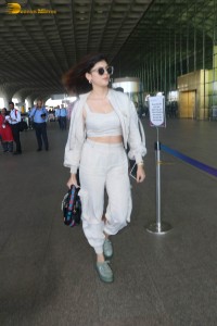 indian actress and model sanjana sanghi in a white dress at Mumbai airport