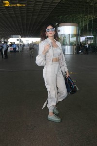 indian actress and model sanjana sanghi in a white dress at Mumbai airport