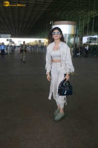 indian actress and model sanjana sanghi in a white dress at Mumbai airport