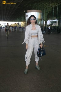 indian actress and model sanjana sanghi in a white dress at Mumbai airport