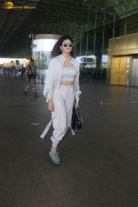 indian actress and model sanjana sanghi in a white dress at Mumbai airport