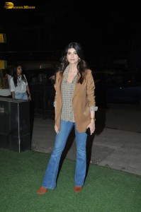 actress Sanjana Sanghi poses in a jacket and denim jeans