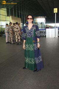 actress Sanya Malhotra in a green and blue dress