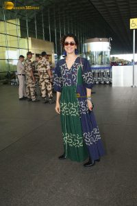actress Sanya Malhotra in a green and blue dress
