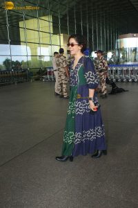 actress Sanya Malhotra in a green and blue dress