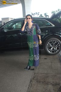 actress Sanya Malhotra in a green and blue dress