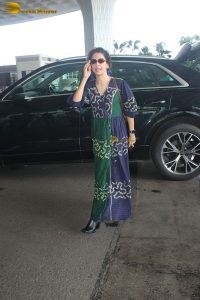 actress Sanya Malhotra in a green and blue dress