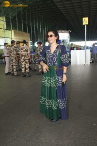 actress Sanya Malhotra in a green and blue dress