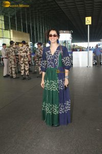 actress Sanya Malhotra in a green and blue dress