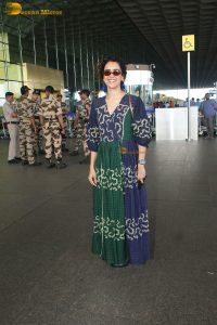 actress Sanya Malhotra in a green and blue dress