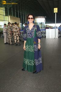 actress Sanya Malhotra in a green and blue dress
