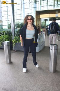 actress Sanya Malhotra in a blue tank top at mumbai airport