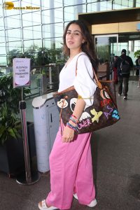 bollywood actress Sara Ali Khan cute in a white top and pink pants