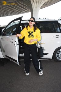 bollywood actress Sara Ali Khan gorgeous in a yellow top and black pants