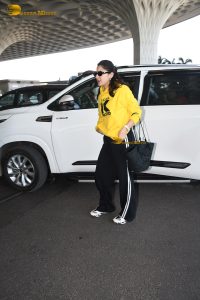 bollywood actress Sara Ali Khan gorgeous in a yellow top and black pants