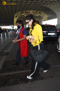 bollywood actress Sara Ali Khan gorgeous in a yellow top and black pants