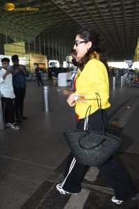 bollywood actress Sara Ali Khan gorgeous in a yellow top and black pants