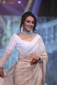 actress seerat kapoor in a white saree doing a ramp walk