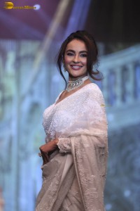 actress seerat kapoor in a white saree doing a ramp walk