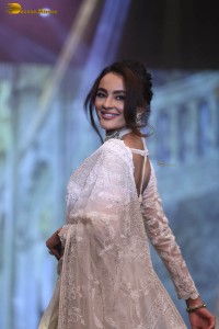 actress seerat kapoor in a white saree doing a ramp walk