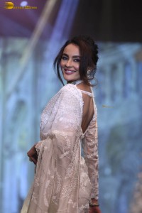 actress seerat kapoor in a white saree doing a ramp walk
