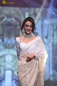 actress seerat kapoor in a white saree doing a ramp walk
