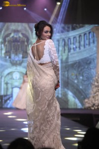 actress seerat kapoor in a white saree doing a ramp walk