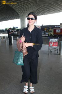 actress Shanaya Kapoor in black overalls at mumbai airport