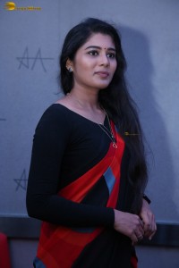 actress Sharanya Pradeep in a black and red saree at a movie event