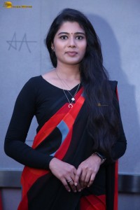 actress Sharanya Pradeep in a black and red saree at a movie event