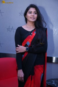 actress Sharanya Pradeep in a black and red saree at a movie event