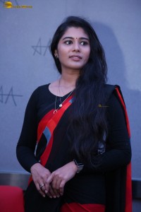 actress Sharanya Pradeep in a black and red saree at a movie event