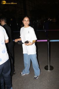 actress and singer Shehnaaz Gill in a white t-shirt and denim jeans at airport