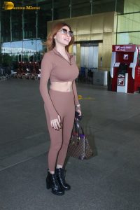 actress and playboy model Sherlyn Chopra in a brown dress at mumbai airport