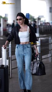 actress Sherlyn Chopra sexy and stylish in a jacket at airport
