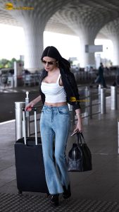 actress Sherlyn Chopra sexy and stylish in a jacket at airport