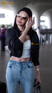 actress Sherlyn Chopra sexy and stylish in a jacket at airport