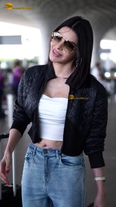 actress Sherlyn Chopra sexy and stylish in a jacket at airport