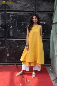 Shilpa Shetty in a yellow salwar kameez dress