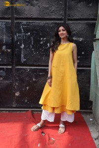 Shilpa Shetty in a yellow salwar kameez dress